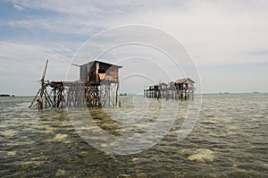Stilted houses on the sea photo