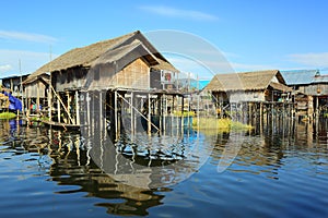 Stilted houses in village on Inle lake photo