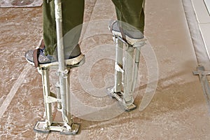 The stilts used in drywalling
