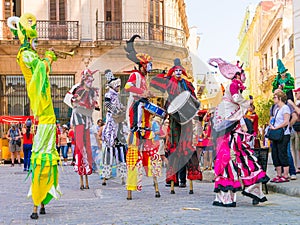 Stiltwalkers dancing to the sound of cuban music in Havana