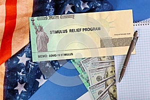 Stimulus financial a bill individual checks from government US 100 dollar bills currency American flag Global pandemic Covid 19