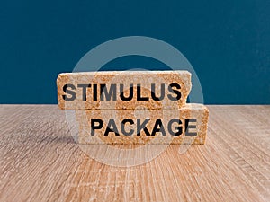 Stimulus package symbol. Concept words stimulus package on wooden blocks.