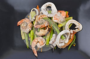 Stir fried asparagus with squid and shrimp with oyster sauce