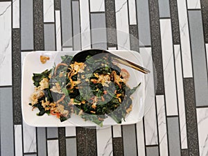 Stir fried baegu leaf with egg