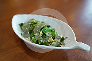 Stir-fried Baegu leaves with egg or Gnetum gnemon or Malindjo.