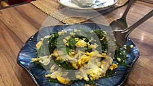 Stir-fried Baegu leaves with egg or Gnetum gnemon or Malindjo, Thai Southern traditional food style