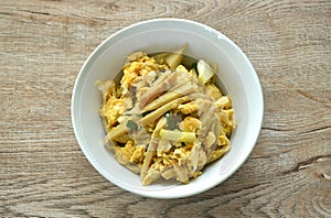 stir fried bamboo shoot and egg with spring onion on bowl