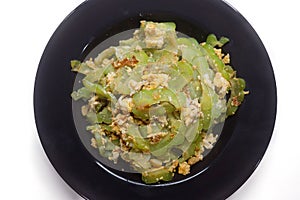 Stir Fried Bitter Gourd with Egg Isolated on white
