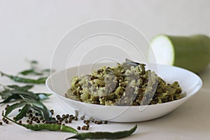 Stir fried Bottle gourd and green gram. A dish made with chopped vegetables and pulsed grated coconut with shallots, green