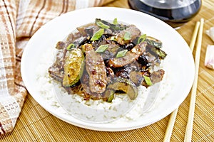 Stir-fried of chicken with zucchini in plate on napkin