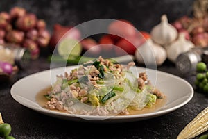 Stir Fried Chinese Cabbage with Minced Pork in White Dish. Selective focus