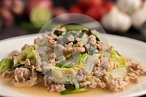 Stir Fried Chinese Cabbage with Minced Pork in White Dish. Selective focus