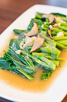 stir-fried chinese kale with shiitake mushroom