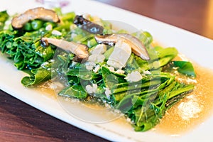 stir-fried chinese kale with shiitake mushroom
