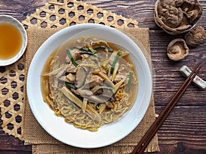 Stir fried egg noodle topped with chicken gravy - Gai see mee or Thai food called Geoy see mee