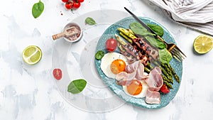 Stir-fried eggs with green asparagus wrapped with bacon. Fast lunch ideas, healthy breakfast, Ketogenic diet. Healthy food, diet
