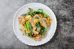 Stir-fried Fresh Rice-flour Noodles With Sliced Pork, Egg and Kale.