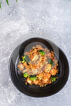 Stir-fried fried fish with broccoli and chili in thai style