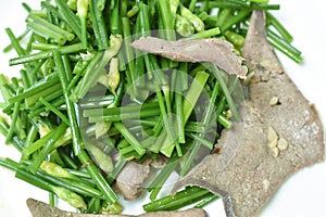 Stir fried garlic chives with pork liver on plate