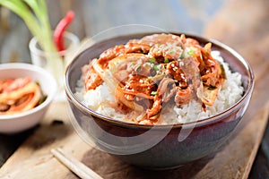 Stir fried kimchi with pork on cooked rice