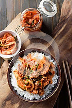 Stir fried kimchi with pork on cooked rice, Korean food