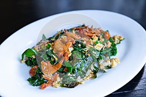 Stir fried melinjo malindjo leaves with egg and crispy dried shrimp, Thai food