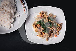 Stir-fried minced pork curry powder in a white plate