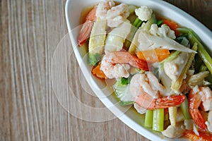 Stir fried mixed vegetable with shrimp in dish and serve with fresh rice in the restaurant