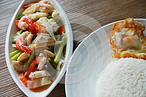 Stir fried mixed vegetable with shrimp in dish and serve with fresh rice in the restaurant.