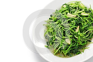 Stir fried pea shoots with garlic