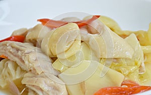 Stir fried pickled cabbage with pork innards and stomach and chili on plate