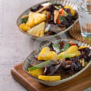 Stir-fried pineapple with black wood ear fungus