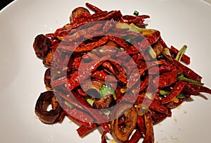 Stir fried pork intestines with chili peppers