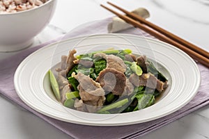 Stir fried pork slices with Chinese kale