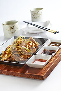 Stir fried pork with spring onion.