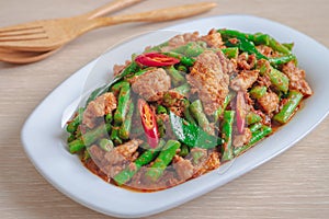 Stir fried pork with yard long bean and red curry paste, Thai food