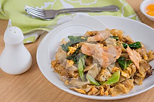 Stir fried rice noodle with pork on plate