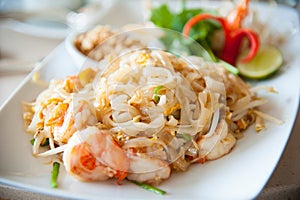 Stir-fried rice noodles with egg, vegetable and shrimp (Pad Thai)