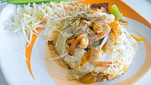 Stir-fried rice noodles with egg, vegetable and shrimp Pad Thai