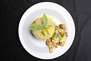 Stir Fried Seafood with Green Curry on white plate,