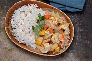 Stir-fried shrimp with curry powder and steamed rice. Thai food