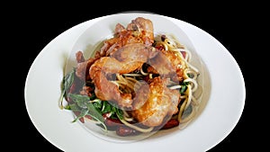 Stir fried spaghetti with dried chili and soft shell crab, clipping part isolated on black background