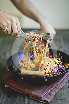 Stir fried spaghetti with organic vegetables