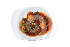 Stir-fried spicy canned fish with basil leaves served Sardines in tomato sauce fried with spicy basil. Thai style food.Clipping