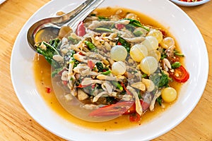 Stir fried spicy catfish roe and Razor clam with Thai herbs