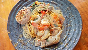 Stir-fried spicy seafood pasta Thai style Spaghetti Pad Kee Mao Talay