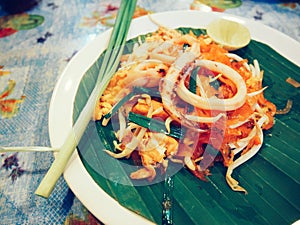 stir fried Thai style small rice noodle with squid or pud thai with squid