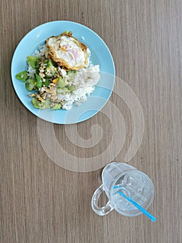 Stir fried vegetable and fried egg with streamrice