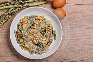 Stir fried Yardlong bean with eggs on wooden background