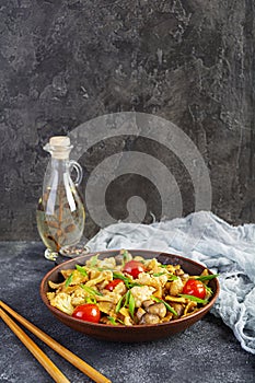 Stir fry farfalle pasta with vegetables, cauliflower and mushrooms